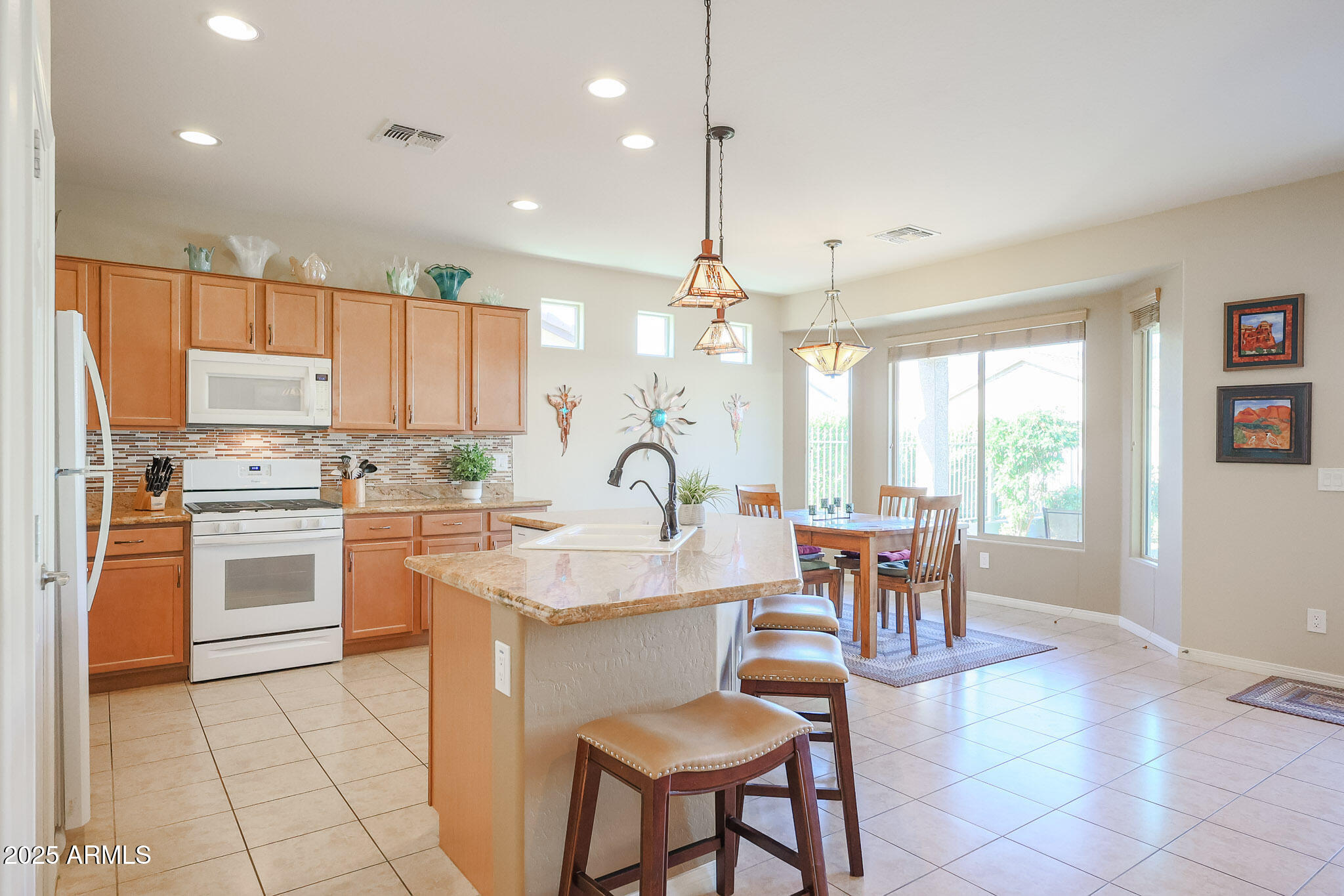 17574 West Nighthawk Way Goodyear, AZ 85338 - Photo 9 of 58 Kitchen and Dining Area