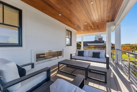 a view of a balcony with wooden floor