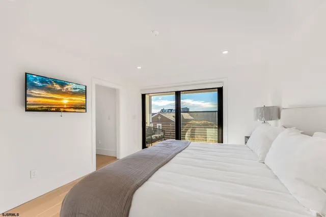 a kitchen with a table chairs microwave and cabinets