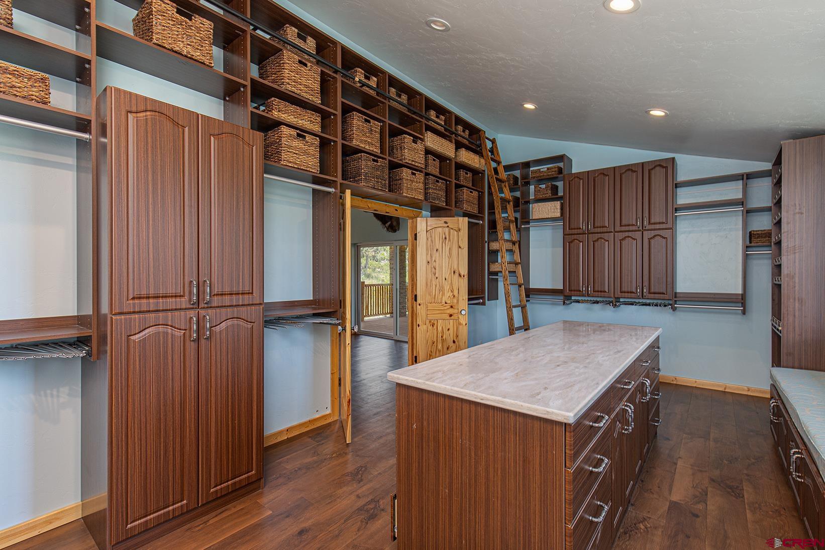 7049 County Road 105 Hesperus, CO 81326 - Photo 16 of 23 a kitchen with a refrigerator and wooden floor