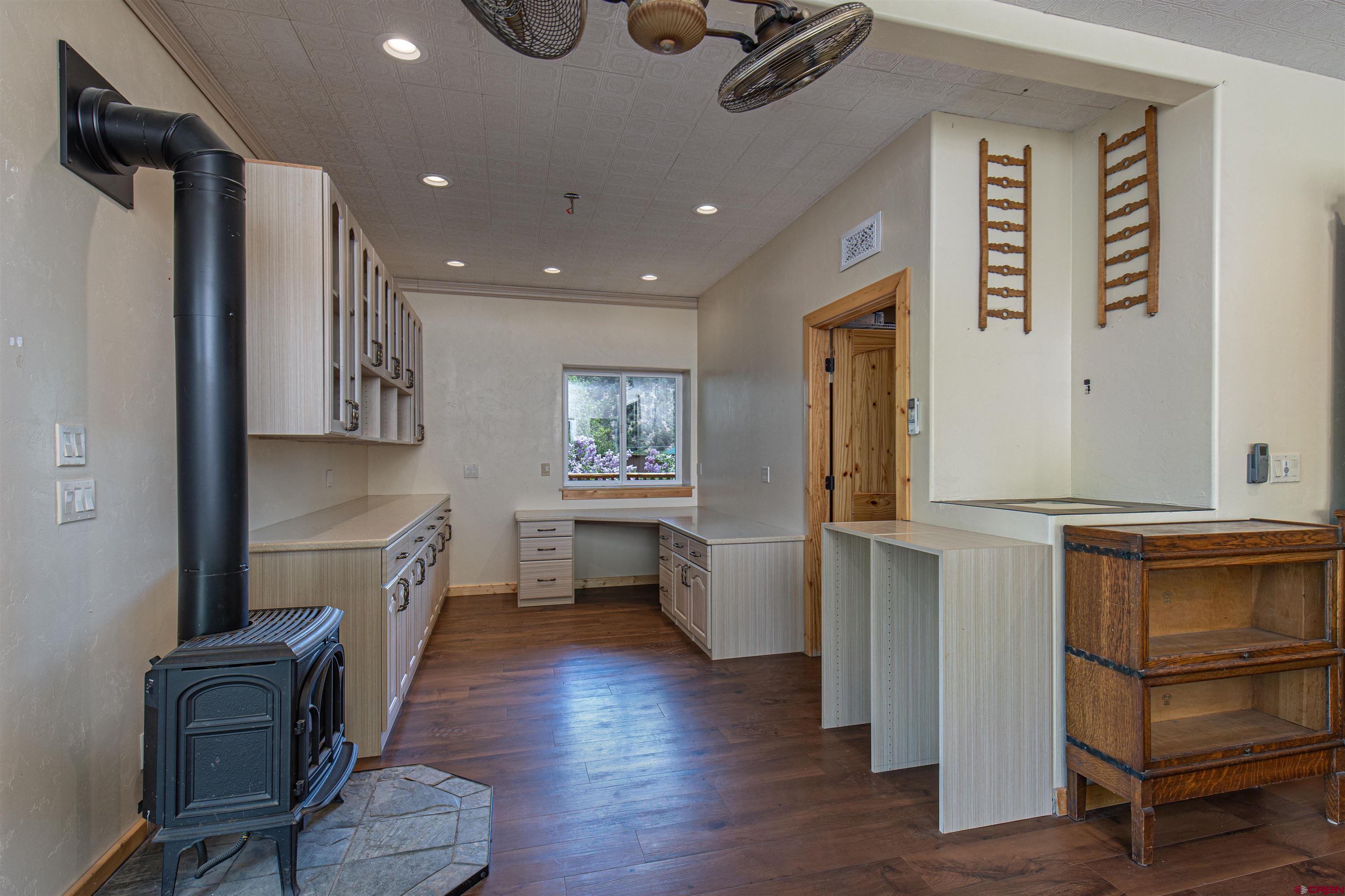 7049 County Road 105 Hesperus, CO 81326 - Photo 18 of 23 a kitchen with a refrigerator and a wooden cabinets