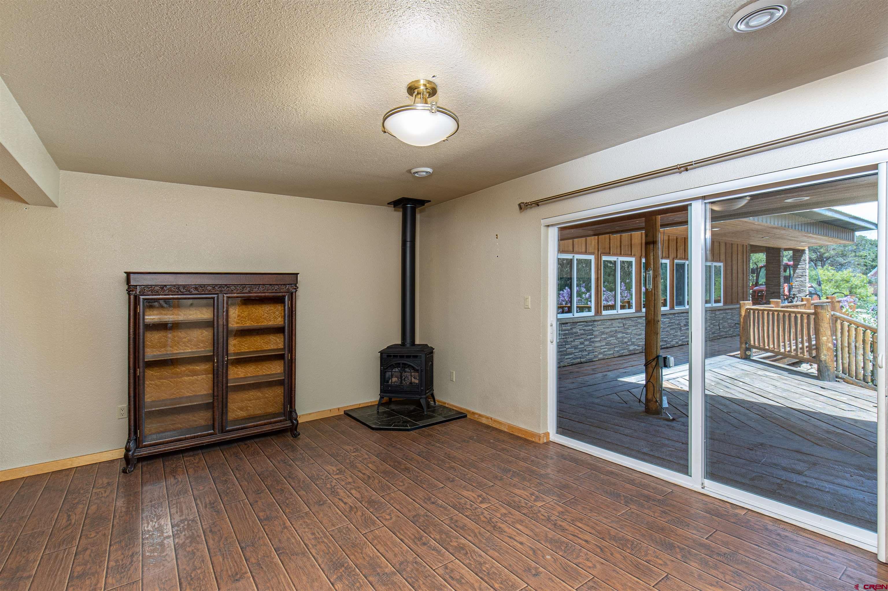 7049 County Road 105 Hesperus, CO 81326 - Photo 20 of 23 wooden floor in an empty room with a window