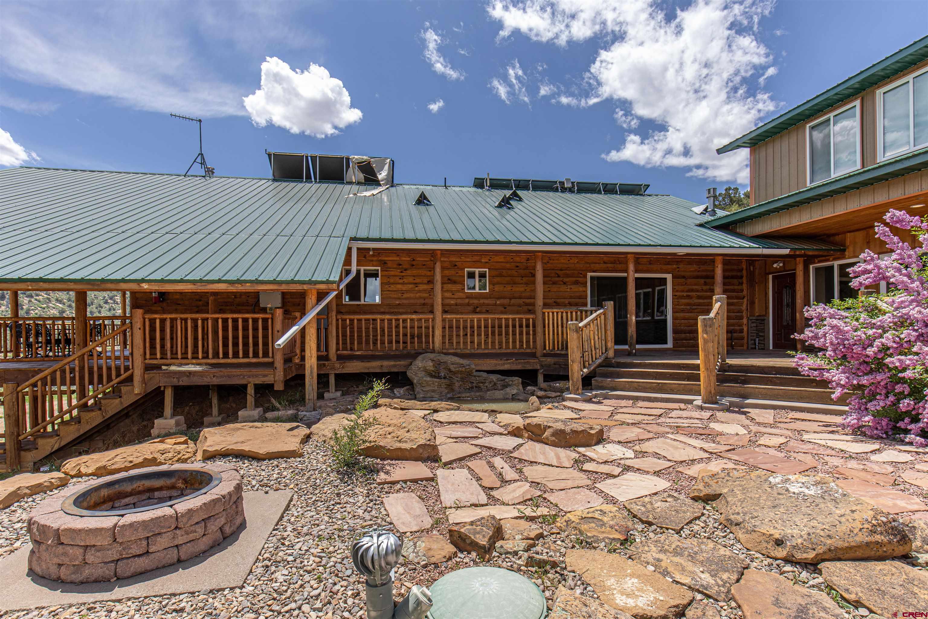 7049 County Road 105 Hesperus, CO 81326 - Photo 5 of 23 a view of a house with backyard porch and sitting area