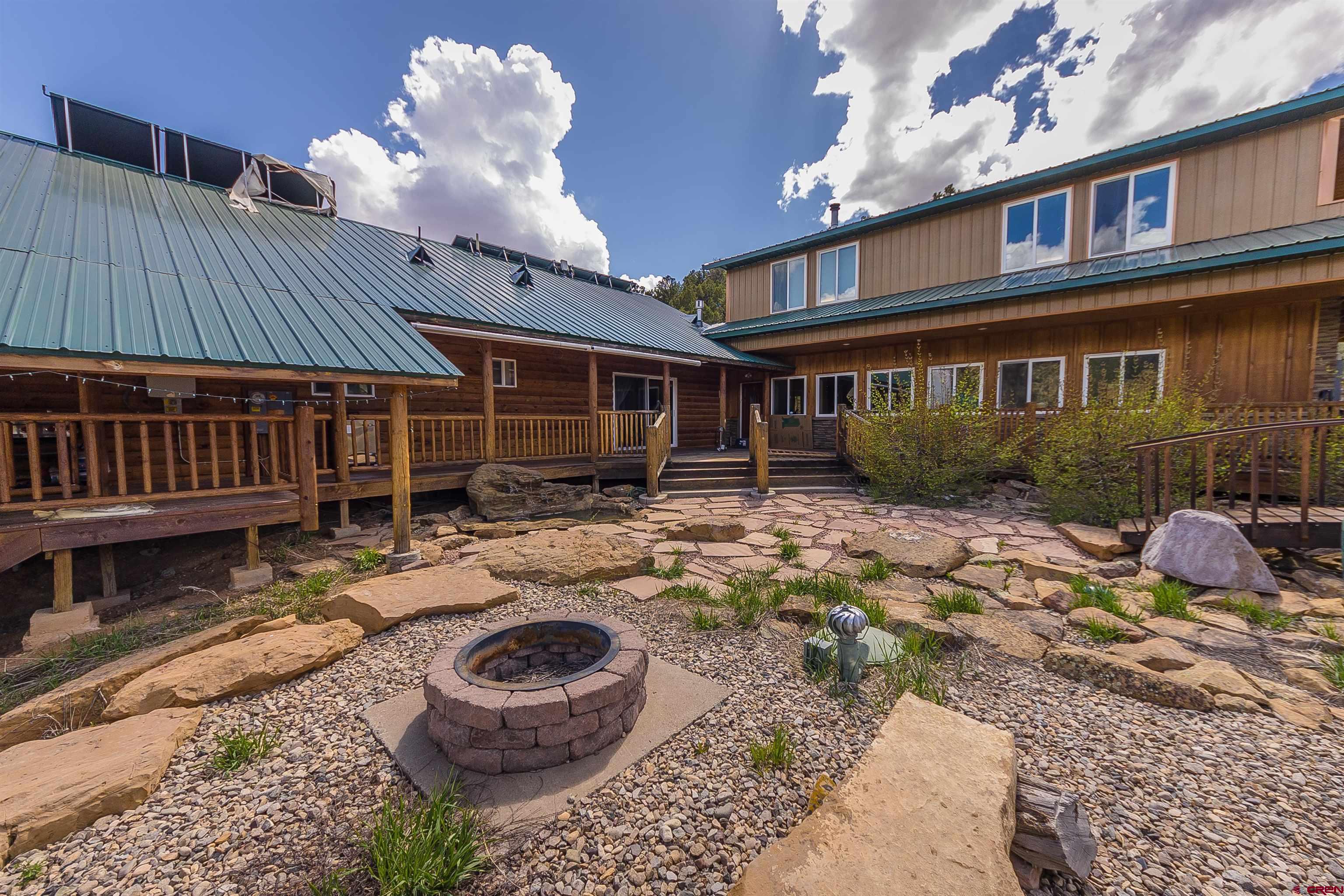 7049 County Road 105 Hesperus, CO 81326 - Photo 6 of 23 a view of a house with backyard and sitting area