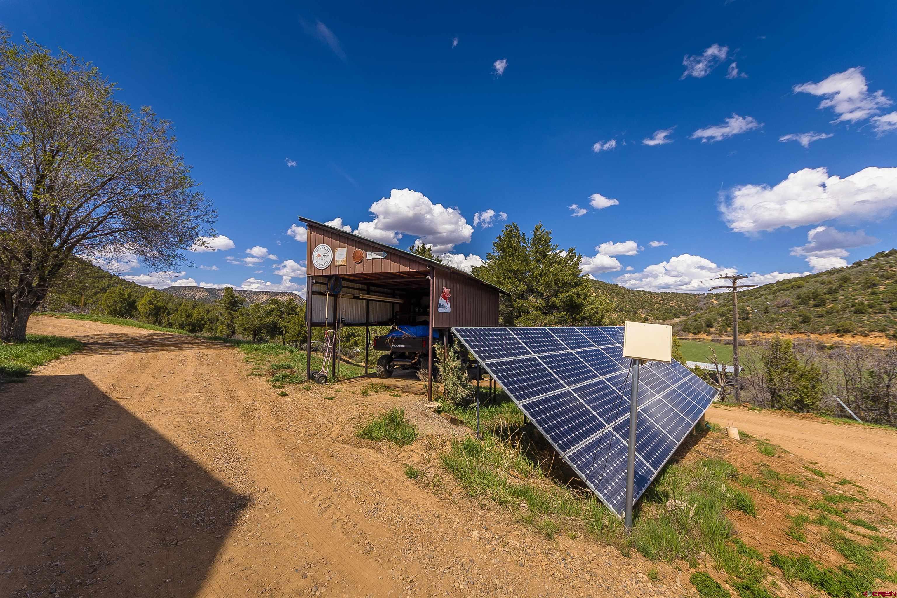 7049 County Road 105 Hesperus, CO 81326 - Photo 7 of 23 a wooden bench sitting in front of a building
