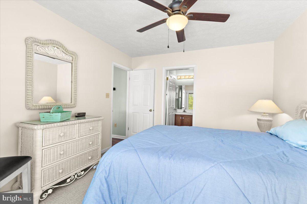 290 Dodee Lane Union Hall, VA 24176 - Photo 20 of 64 a bedroom with a bed and a chandelier fan
