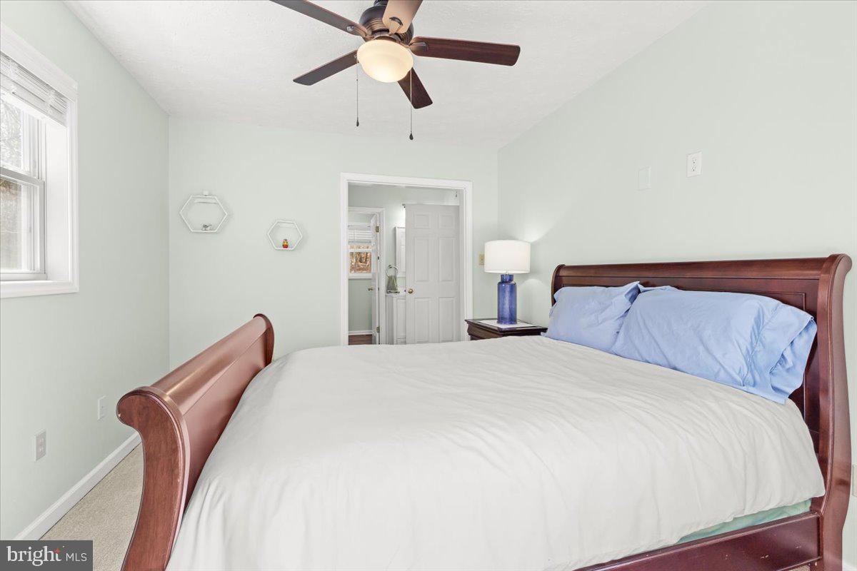 290 Dodee Lane Union Hall, VA 24176 - Photo 25 of 64 a bedroom with a bed and a chandelier