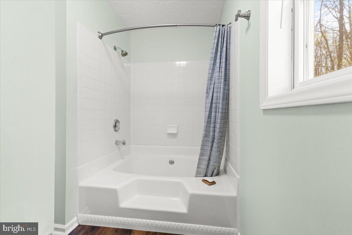 290 Dodee Lane Union Hall, VA 24176 - Photo 29 of 64 a bathroom with a bathtub and a shower