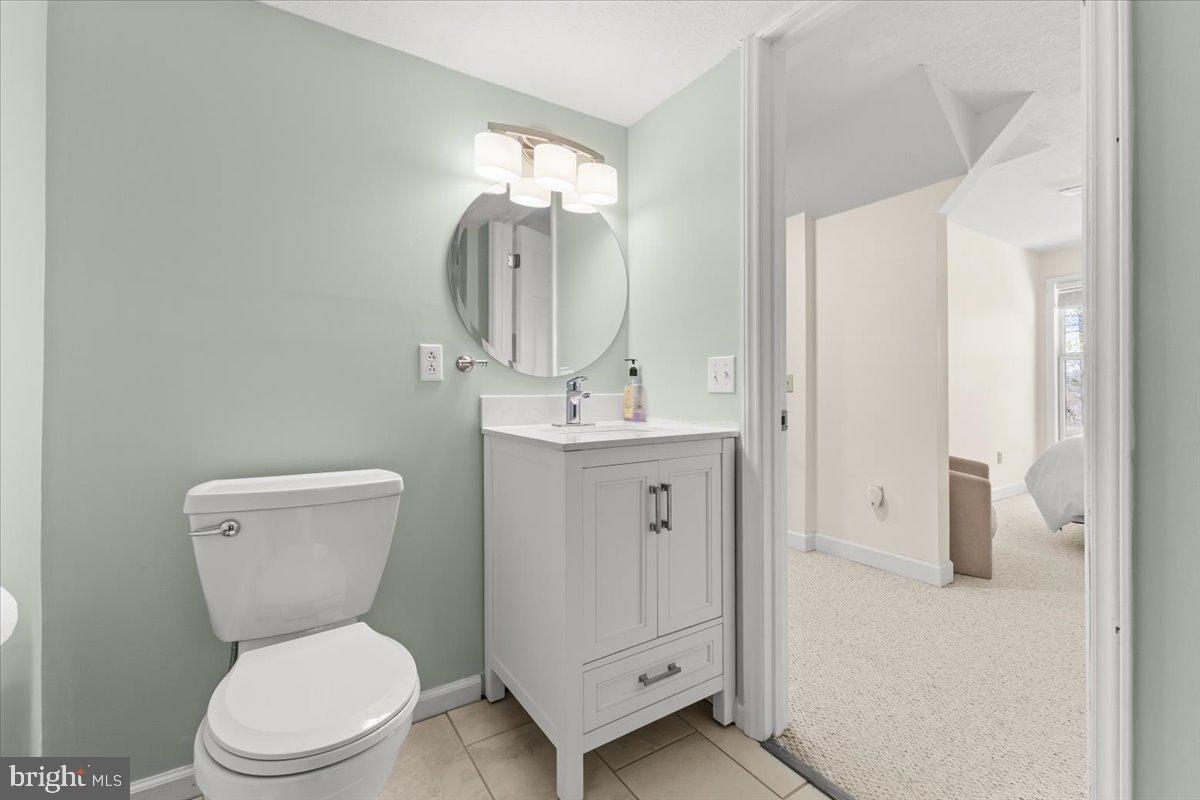 290 Dodee Lane Union Hall, VA 24176 - Photo 31 of 64 a bathroom with a toilet sink and mirror
