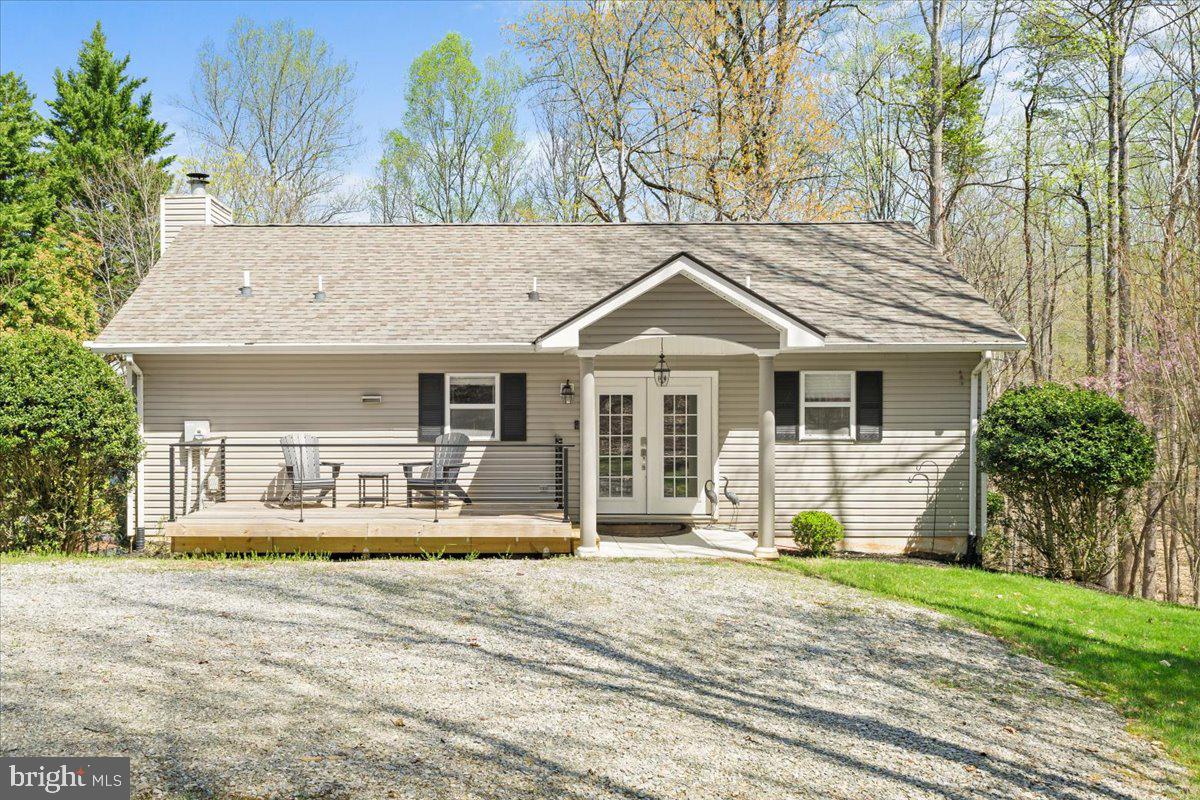 290 Dodee Lane Union Hall, VA 24176 - Photo 4 of 64 a front view of a house with a yard outdoor seating and garage