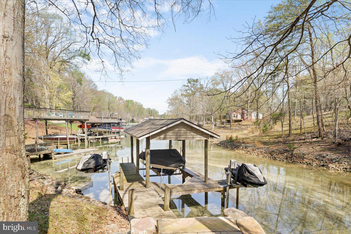 290 Dodee Lane Union Hall, VA 24176 - Photo 46 of 64 a view of a terrace with chairs and a wooden fence