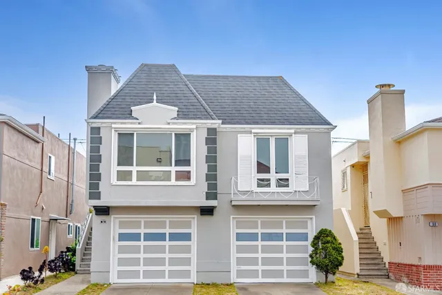 a front view of a house with large windows