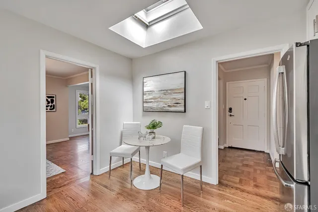 a view of a livingroom with furniture and wooden floor