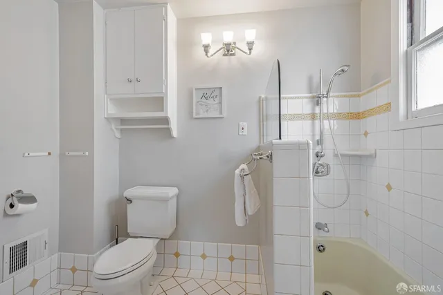 a bathroom with a sink a vanity a mirror and a bathtub