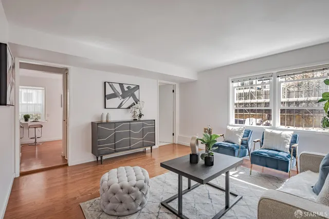a living room with furniture and a table