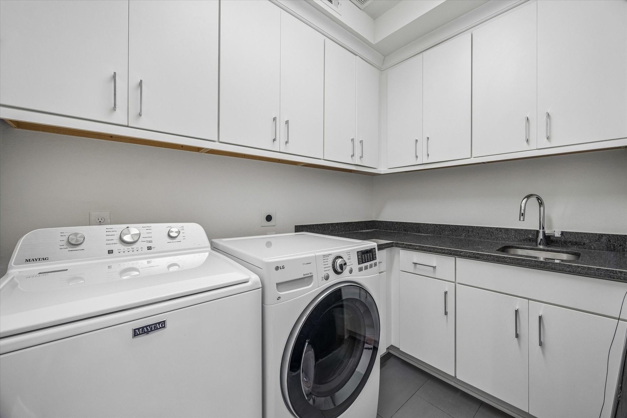 1526 Vermont Street Houston, TX 77006 - Photo 34 of 39 Generous utility room with abundant cabinetry, counter space, sink, and room for everyday organization.