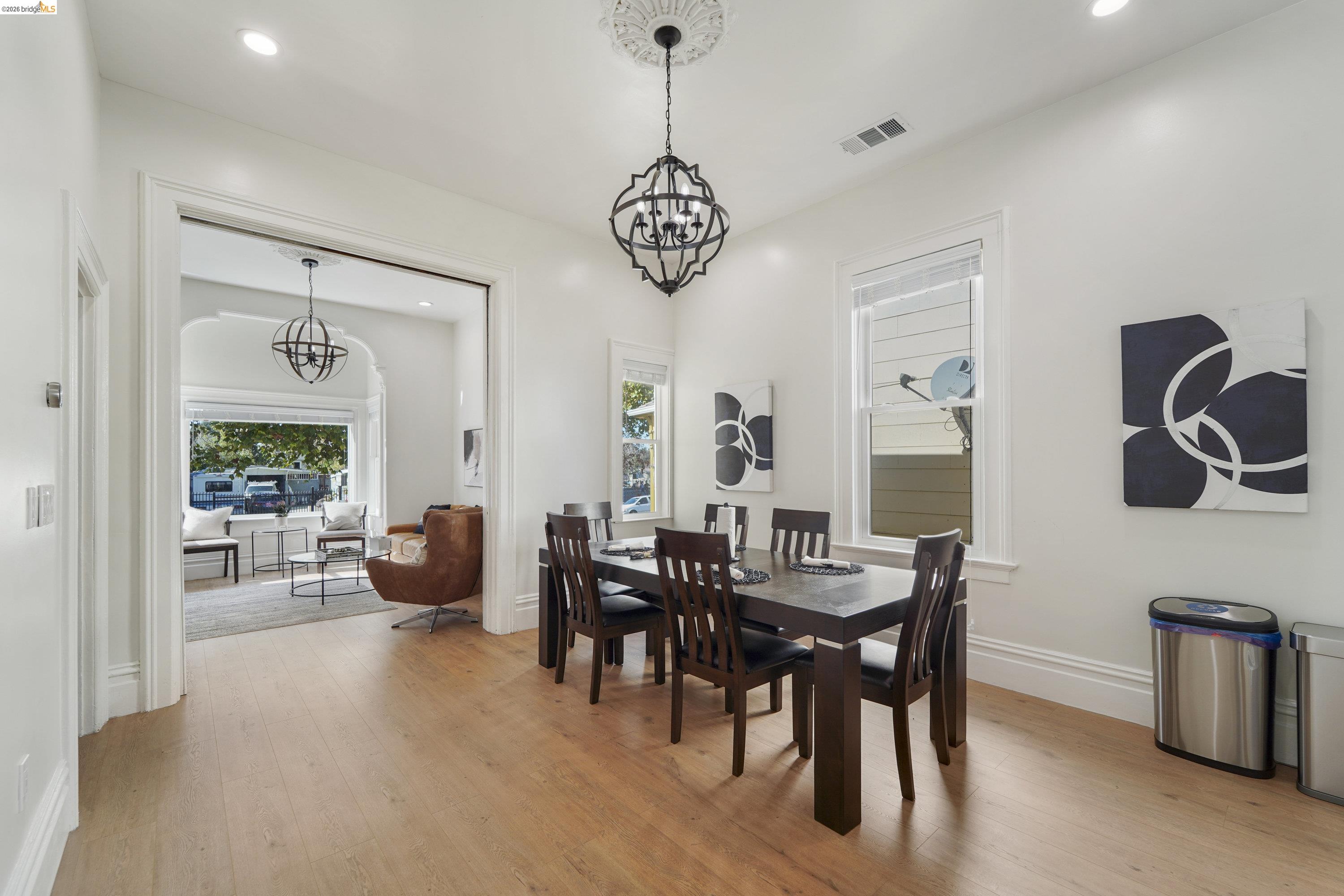 1662 14th Street Oakland, CA 94607 - Photo 13 of 57 a view of a dining room with furniture and chandelier