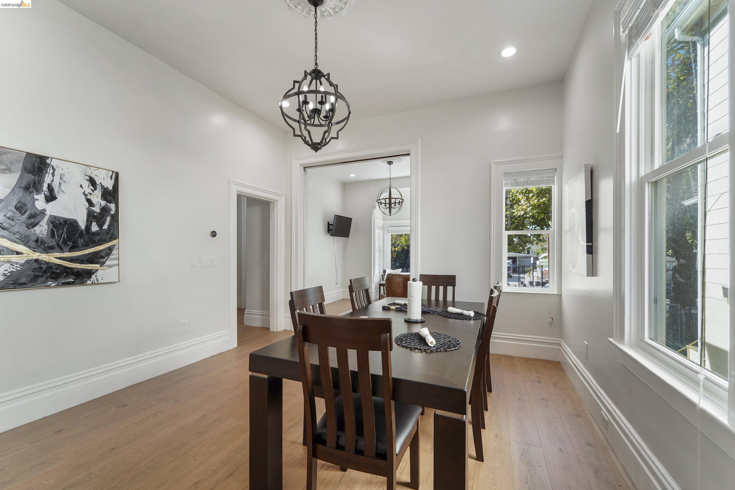 1662 14th Street Oakland, CA 94607 - Photo 14 of 57 a view of a dining room with furniture window and wooden floor