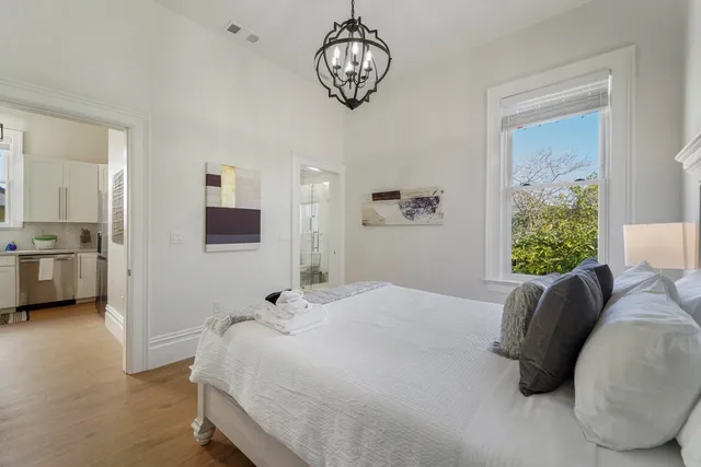 a bathroom with double vanity sink and a window