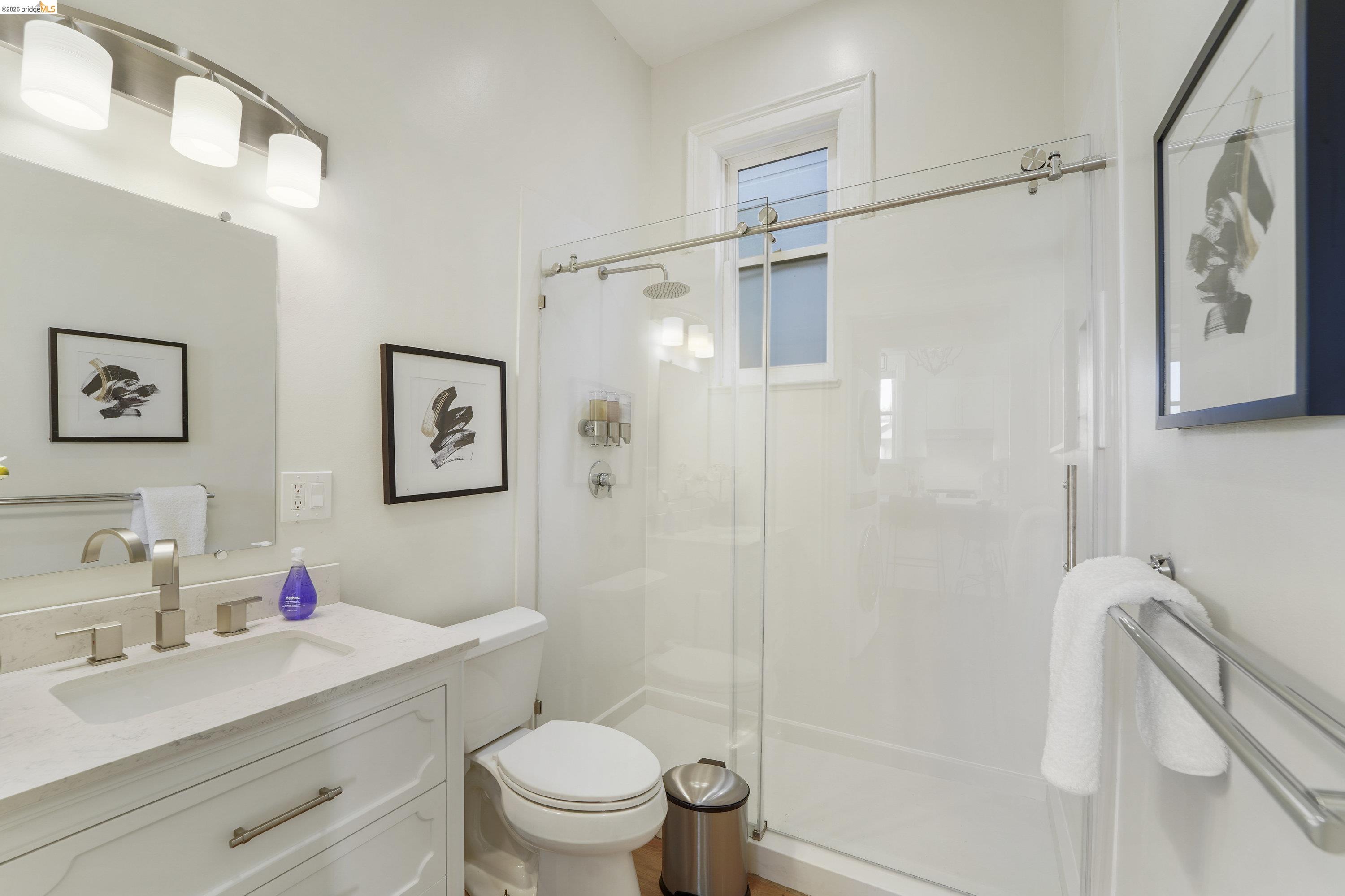 1662 14th Street Oakland, CA 94607 - Photo 27 of 57 a bathroom with a sink toilet and shower