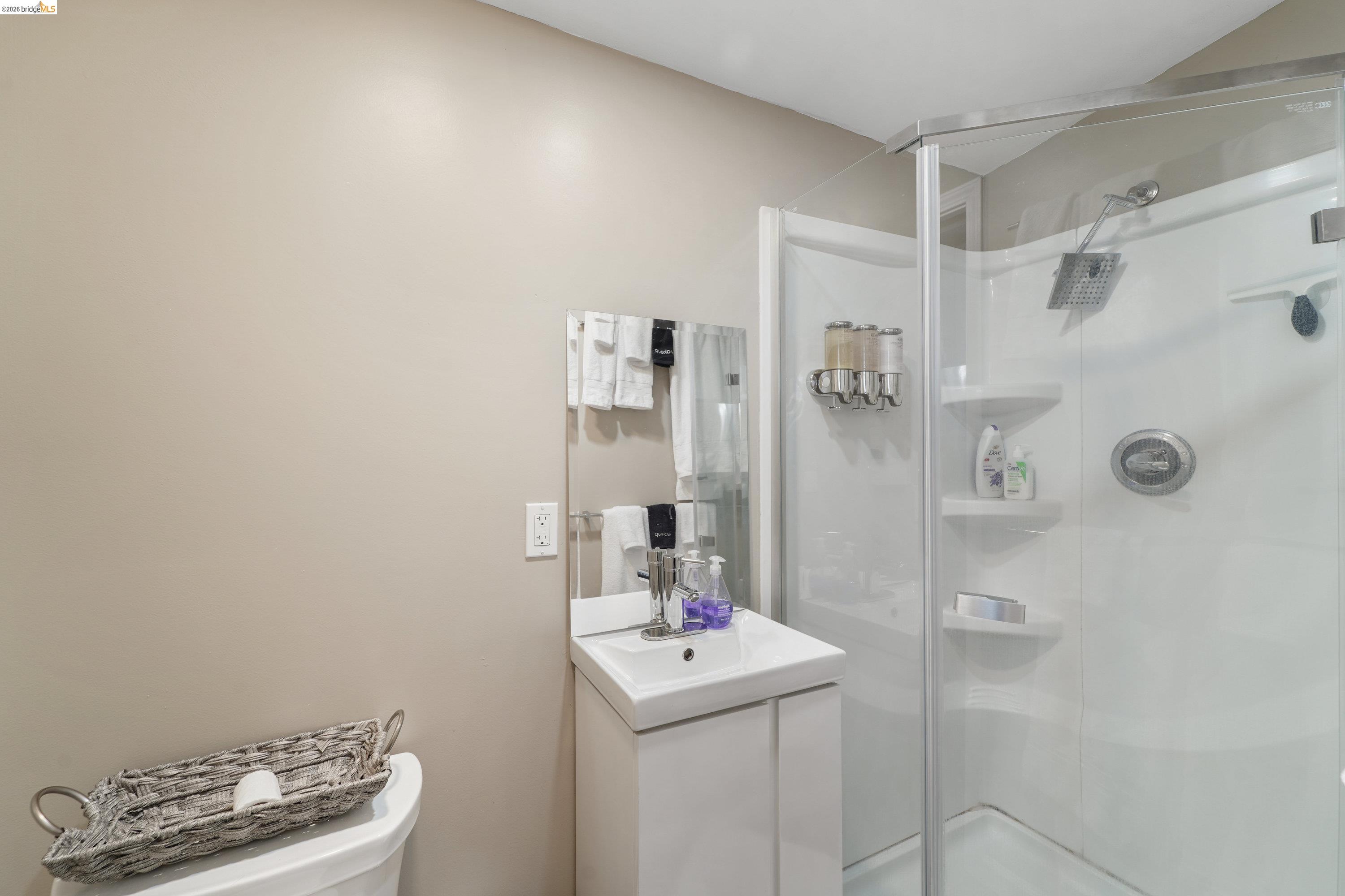 1662 14th Street Oakland, CA 94607 - Photo 37 of 57 a bathroom with a sink toilet and shower