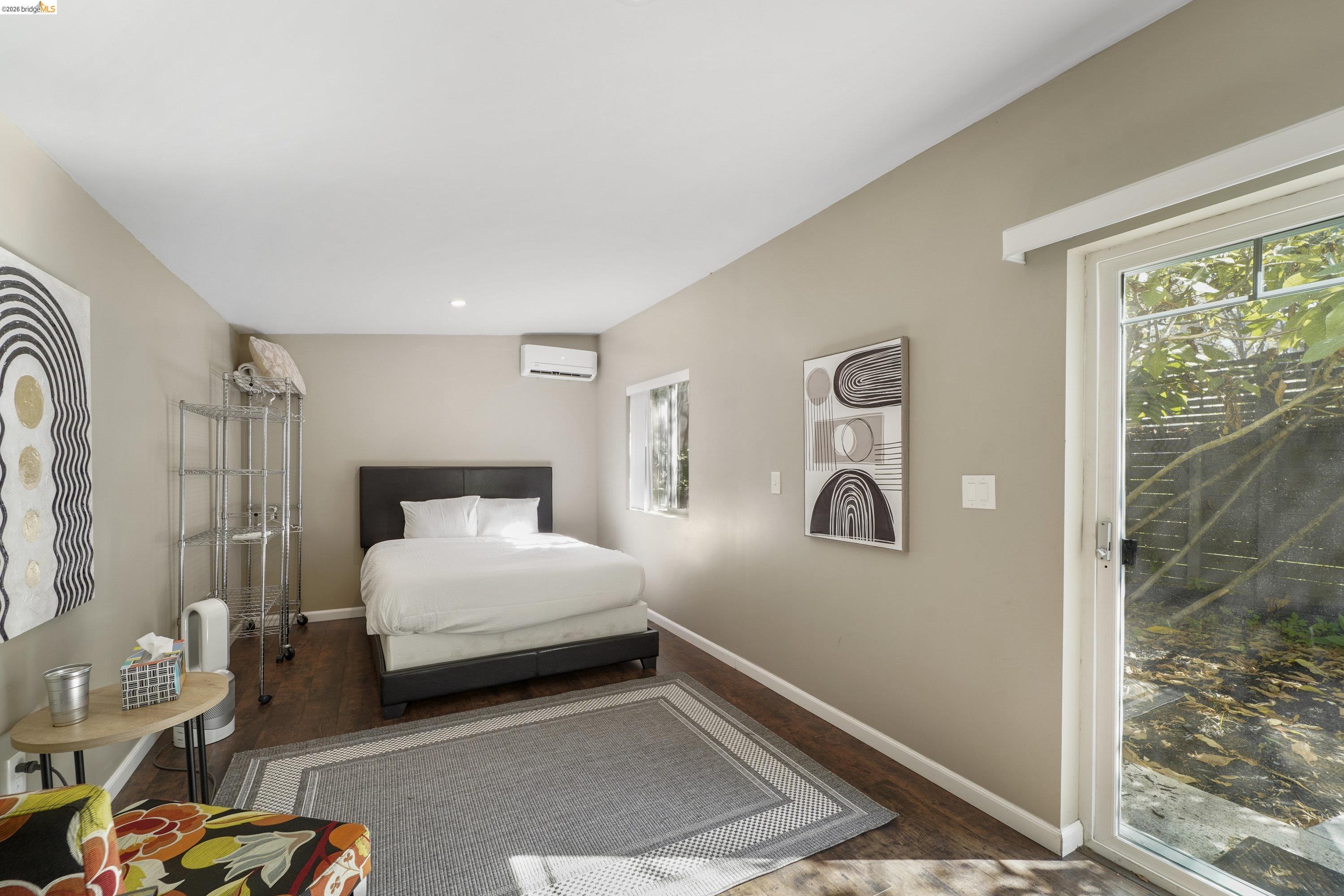 1662 14th Street Oakland, CA 94607 - Photo 40 of 57 a bedroom with a bed and a window