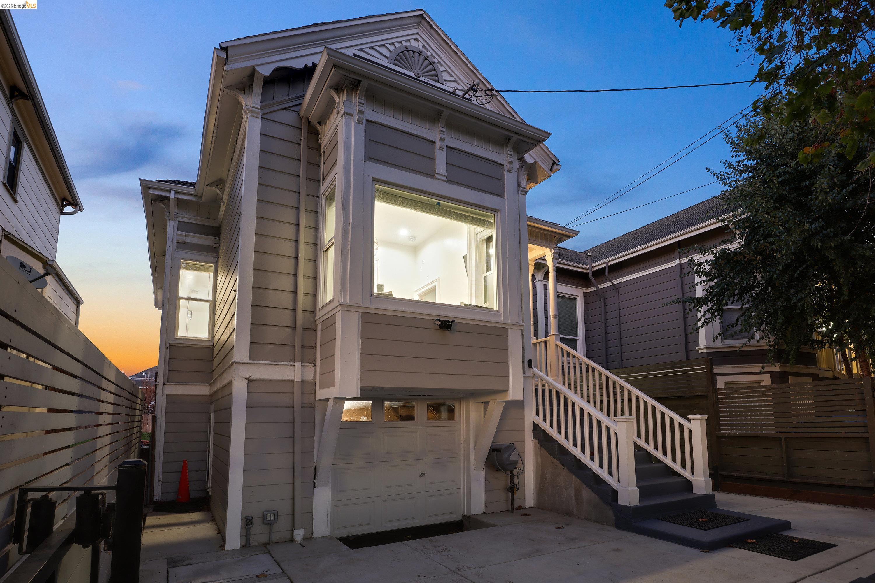 1662 14th Street Oakland, CA 94607 - Photo 54 of 57 a view of a wooden house with a small yard and wooden floor and fence