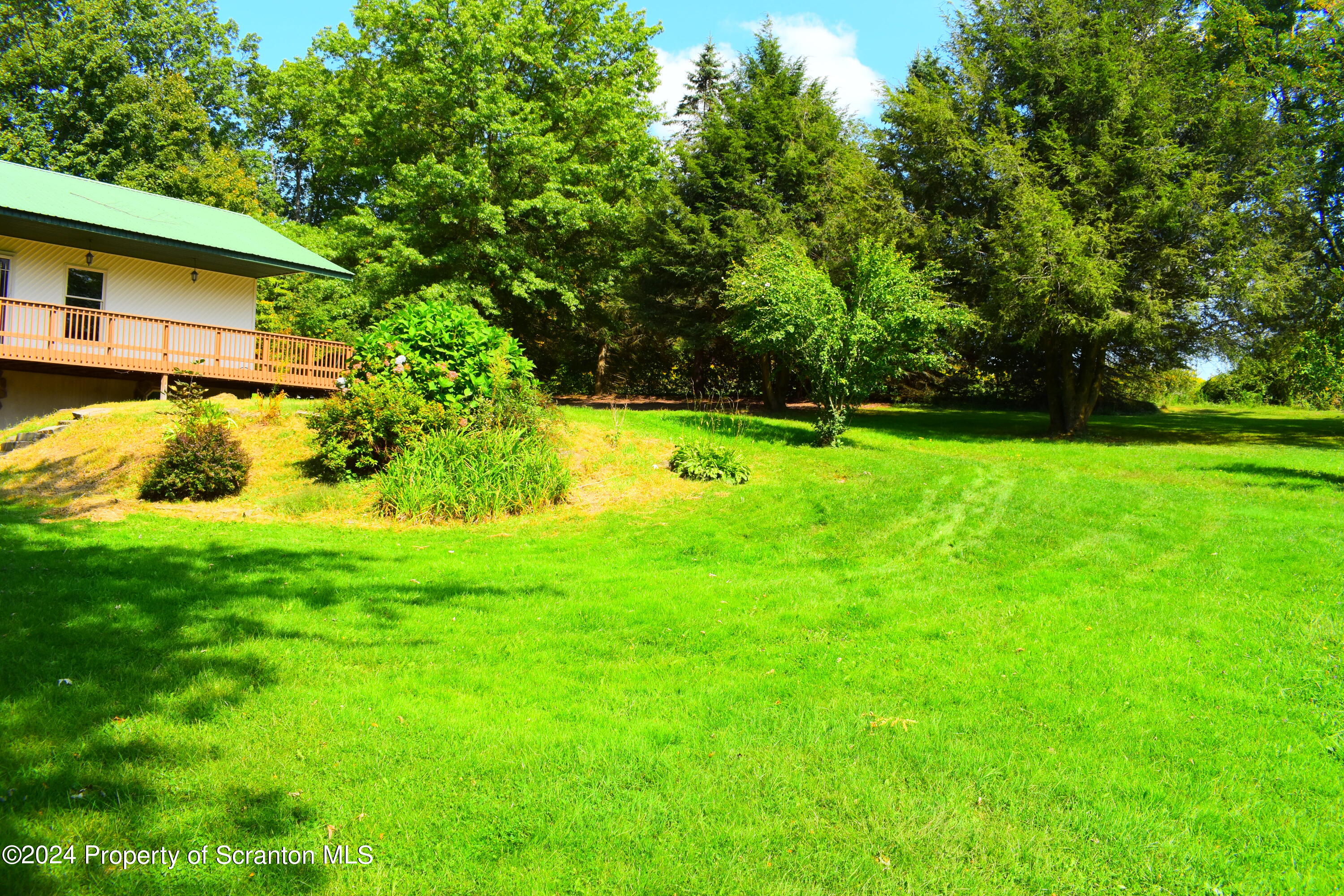 7678 State Rte 3023 Montrose, PA 18801 - Photo 26 of 29 a view of a backyard with a small cabin