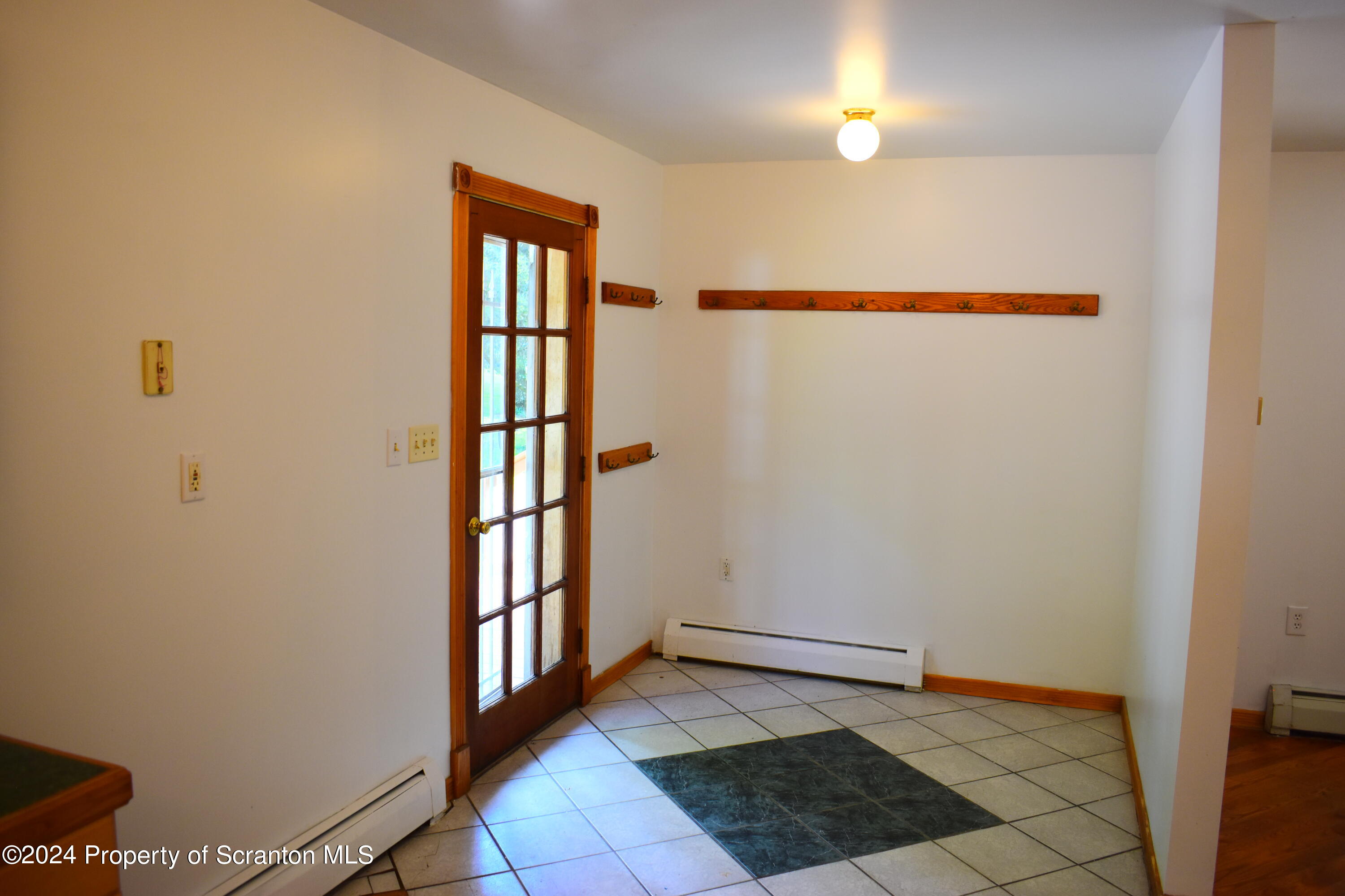 7678 State Rte 3023 Montrose, PA 18801 - Photo 3 of 29 a view of an entryway with wooden floor