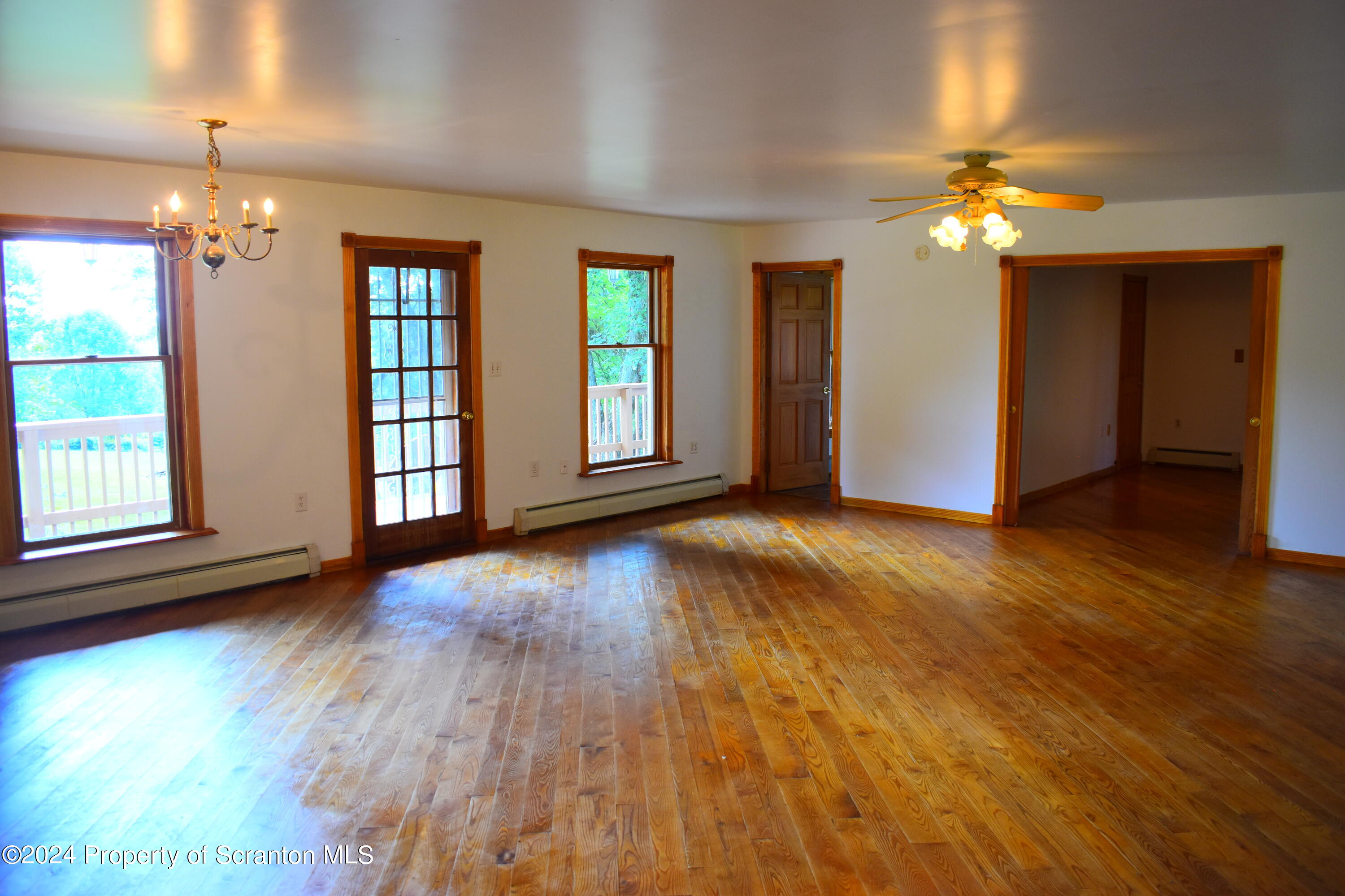 7678 State Rte 3023 Montrose, PA 18801 - Photo 7 of 29 a view of an empty room with window and wooden floor
