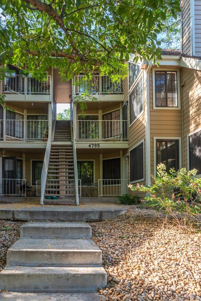 4795 White Rock Circle, Unit E Boulder, CO 80301 - Photo 3 of 26 a front view of house with a garden