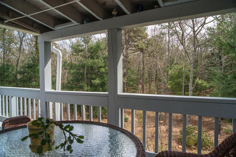 68 Sandy Valley Road Marstons Mills, MA 02648 - Photo 4 of 18 a view of a porch with wooden floor