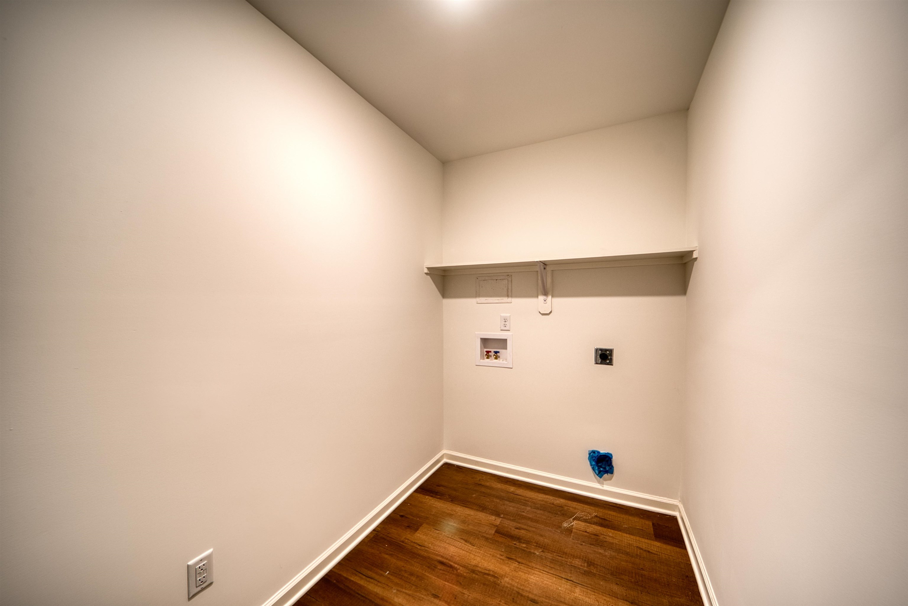 108 Walnut Ridge Ripley, TN 38063 - Photo 19 of 35 Washroom with hookup for a washing machine, dark wood finished floors, and electric dryer hookup
