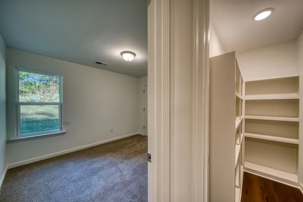 a view of an empty room with a window