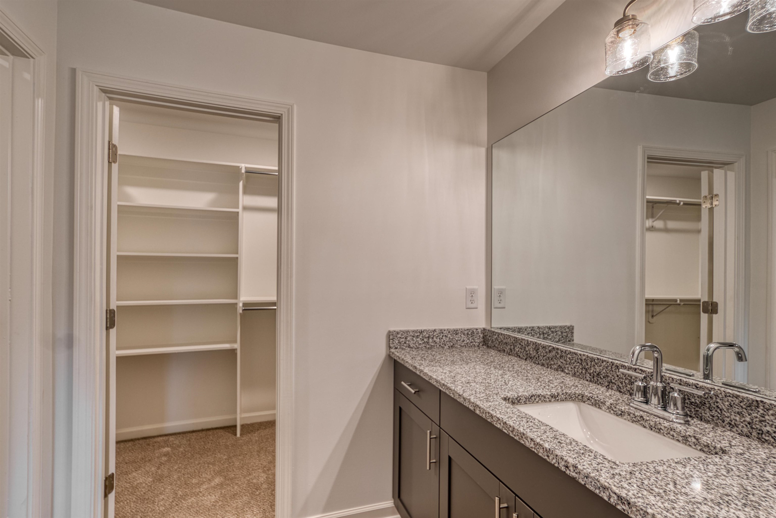 108 Walnut Ridge Ripley, TN 38063 - Photo 21 of 35 a bathroom with a granite countertop sink and a mirror