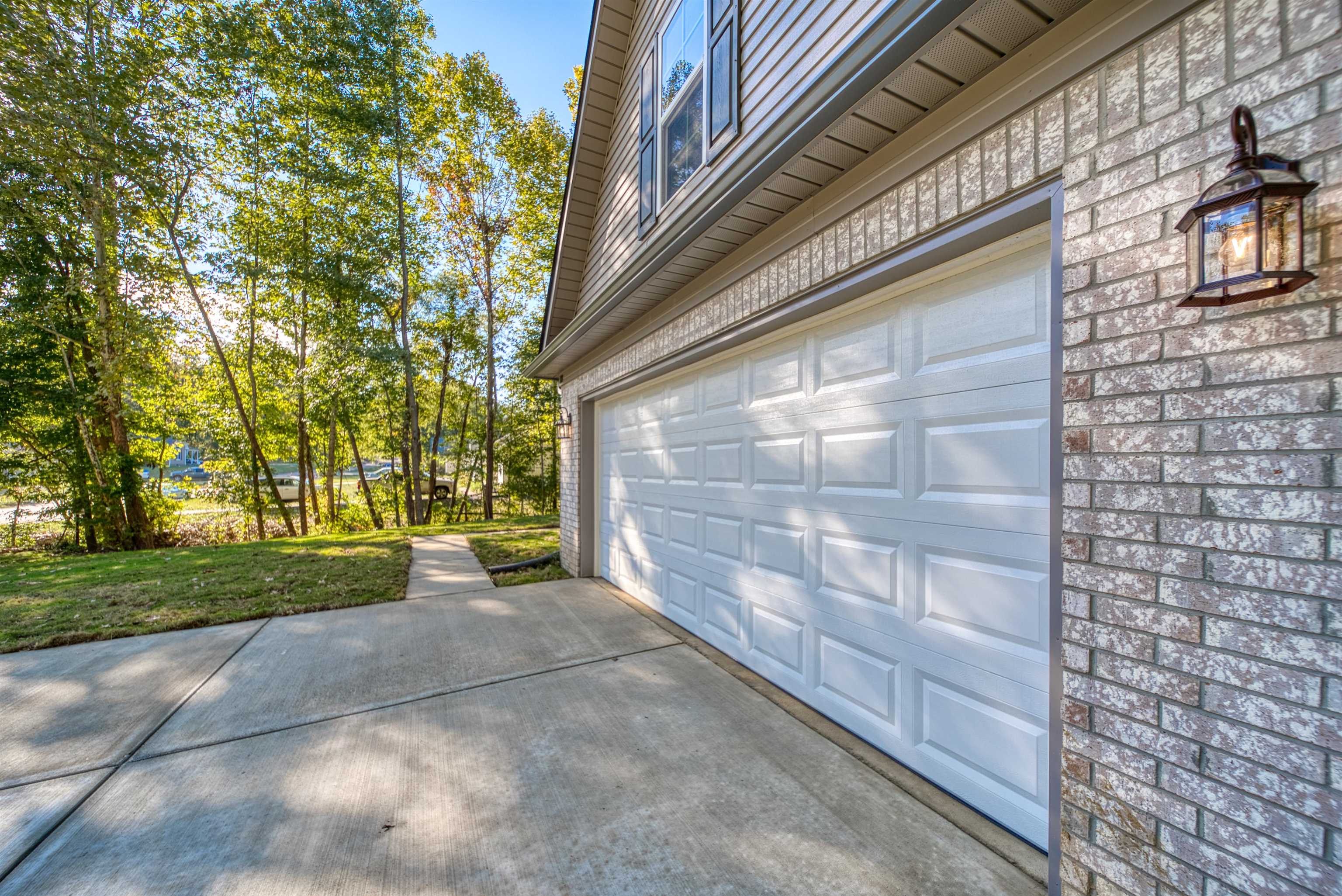 108 Walnut Ridge Ripley, TN 38063 - Photo 28 of 35 Garage featuring concrete driveway