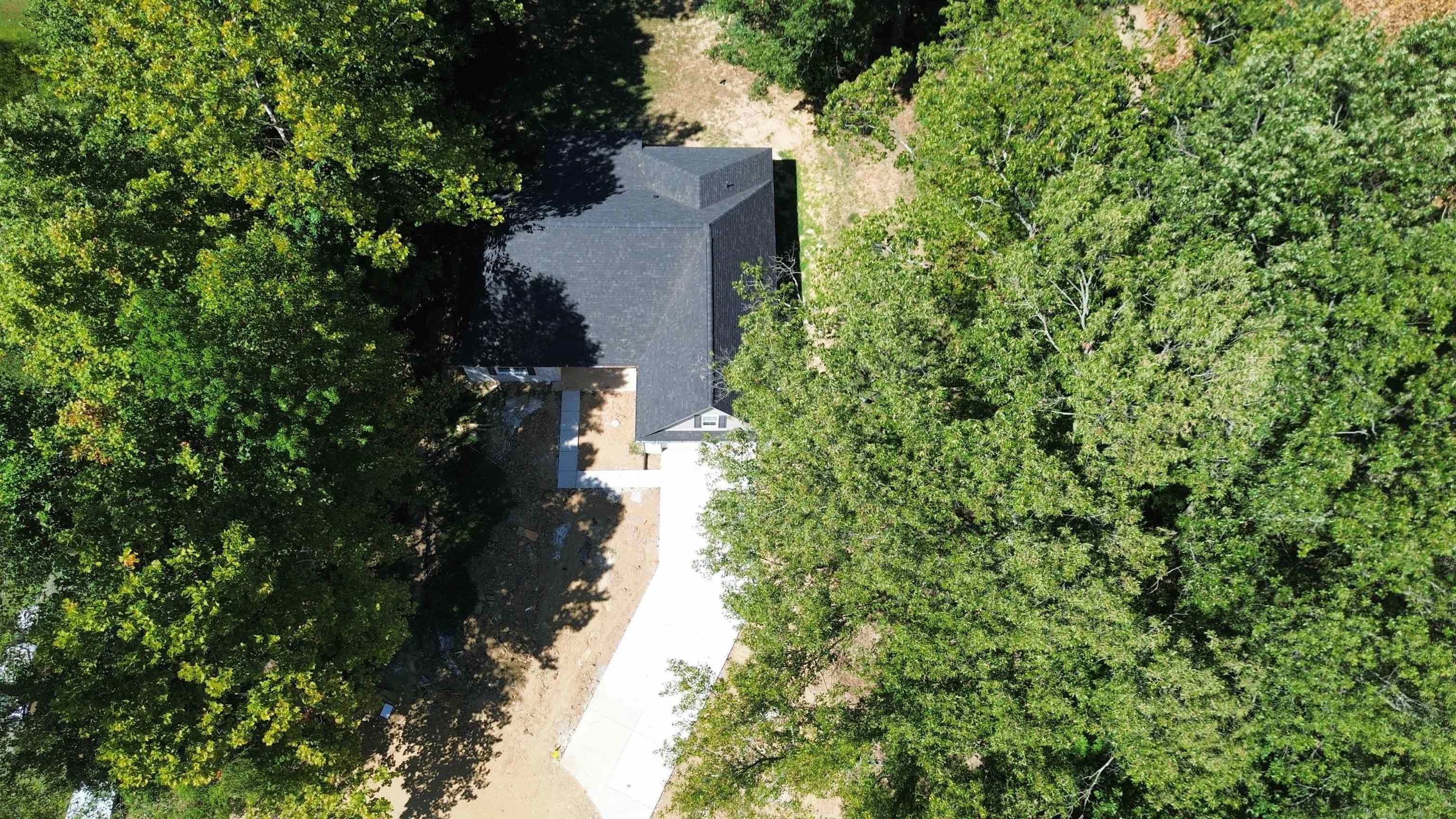 108 Walnut Ridge Ripley, TN 38063 - Photo 33 of 35 an aerial view of residential house with outdoor space and trees all around