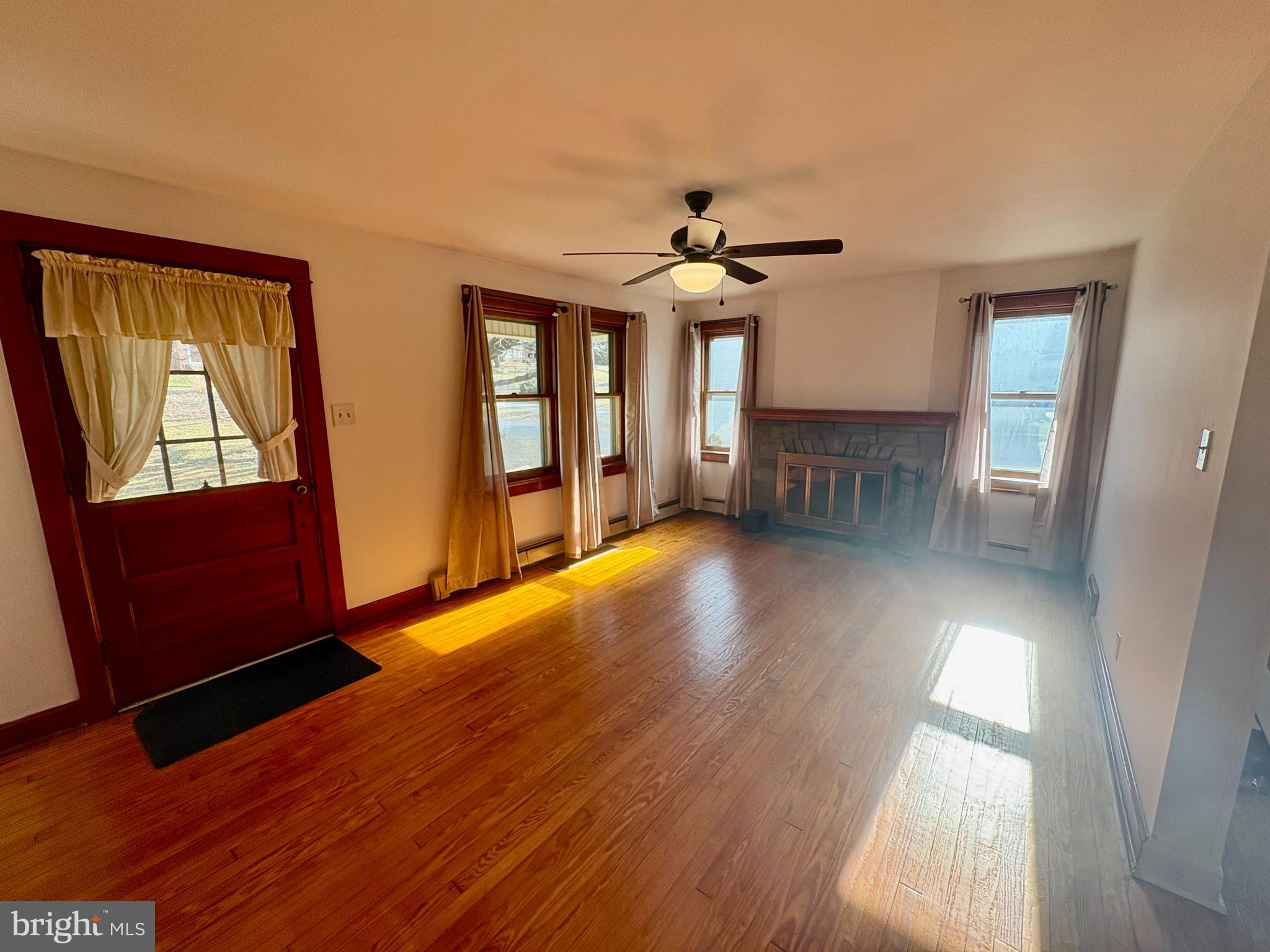 424 Lampeter Road Lancaster, PA 17602 - Photo 12 of 41 a view of empty room with wooden floor and fan