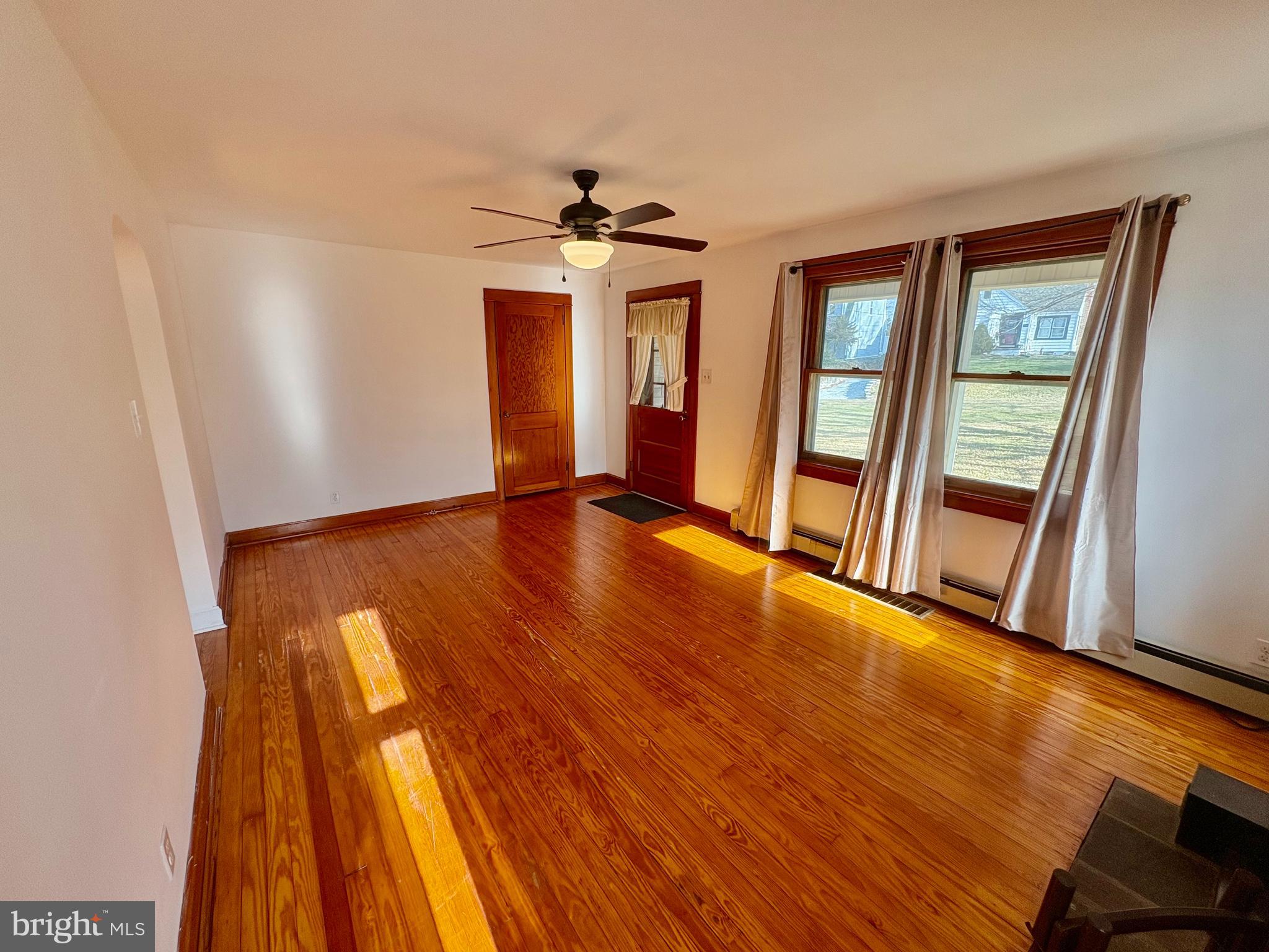 424 Lampeter Road Lancaster, PA 17602 - Photo 13 of 41 wooden floor in an empty room with a window