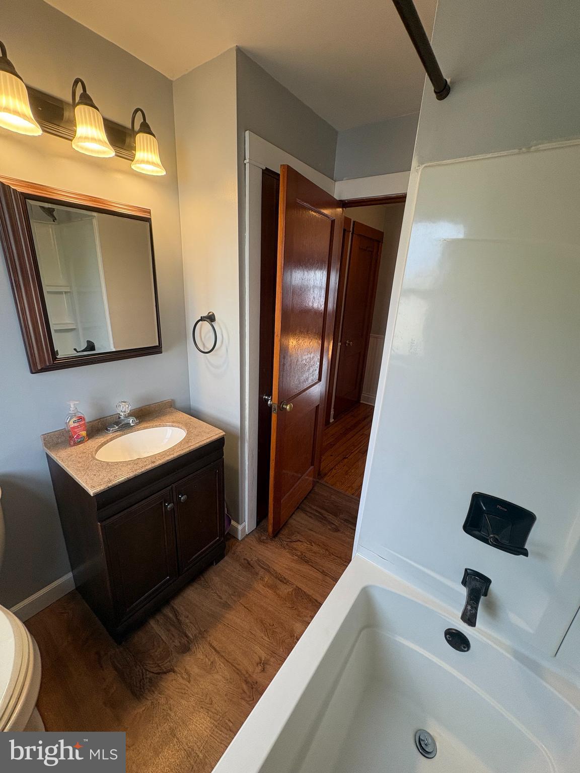 424 Lampeter Road Lancaster, PA 17602 - Photo 20 of 41 a bathroom with a sink a mirror and a bathtub