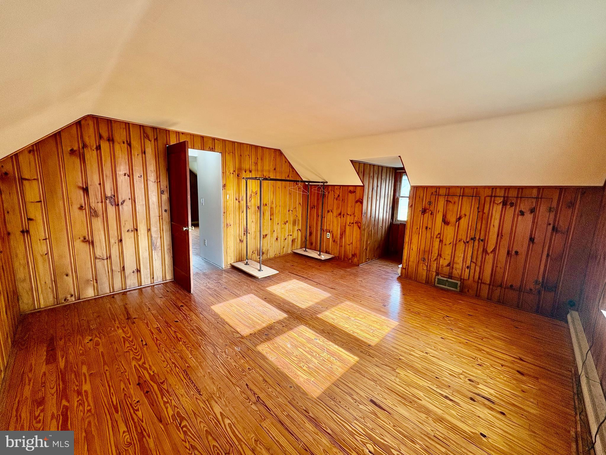424 Lampeter Road Lancaster, PA 17602 - Photo 23 of 41 a view of an empty room with wooden floor and a window