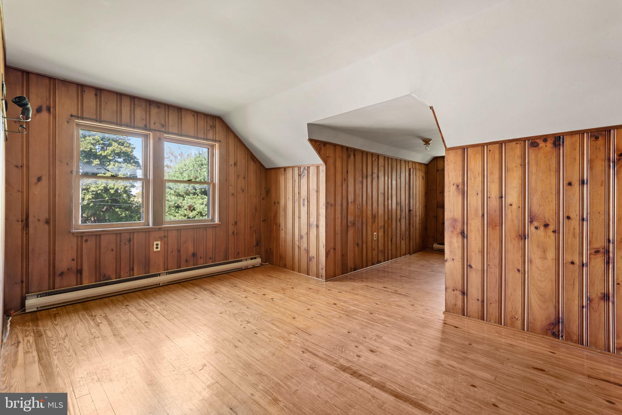 424 Lampeter Road Lancaster, PA 17602 - Photo 28 of 41 a view of an empty room with a window and wooden floor