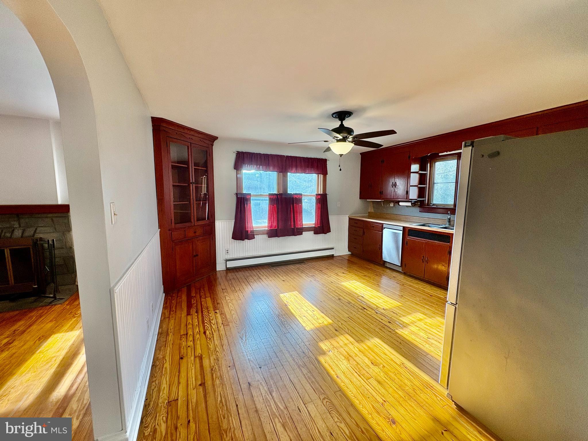 424 Lampeter Road Lancaster, PA 17602 - Photo 8 of 41 a living room with stainless steel appliances furniture a fireplace and a flat screen tv