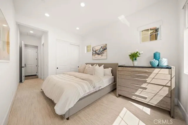 a bedroom with a bed and a couch