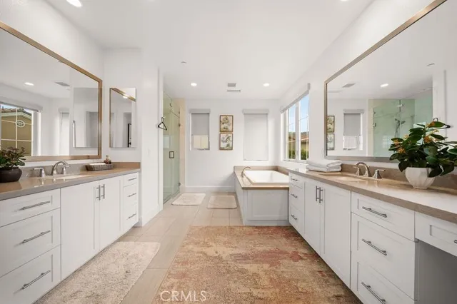 a large bathroom with a granite countertop sink mirror and a