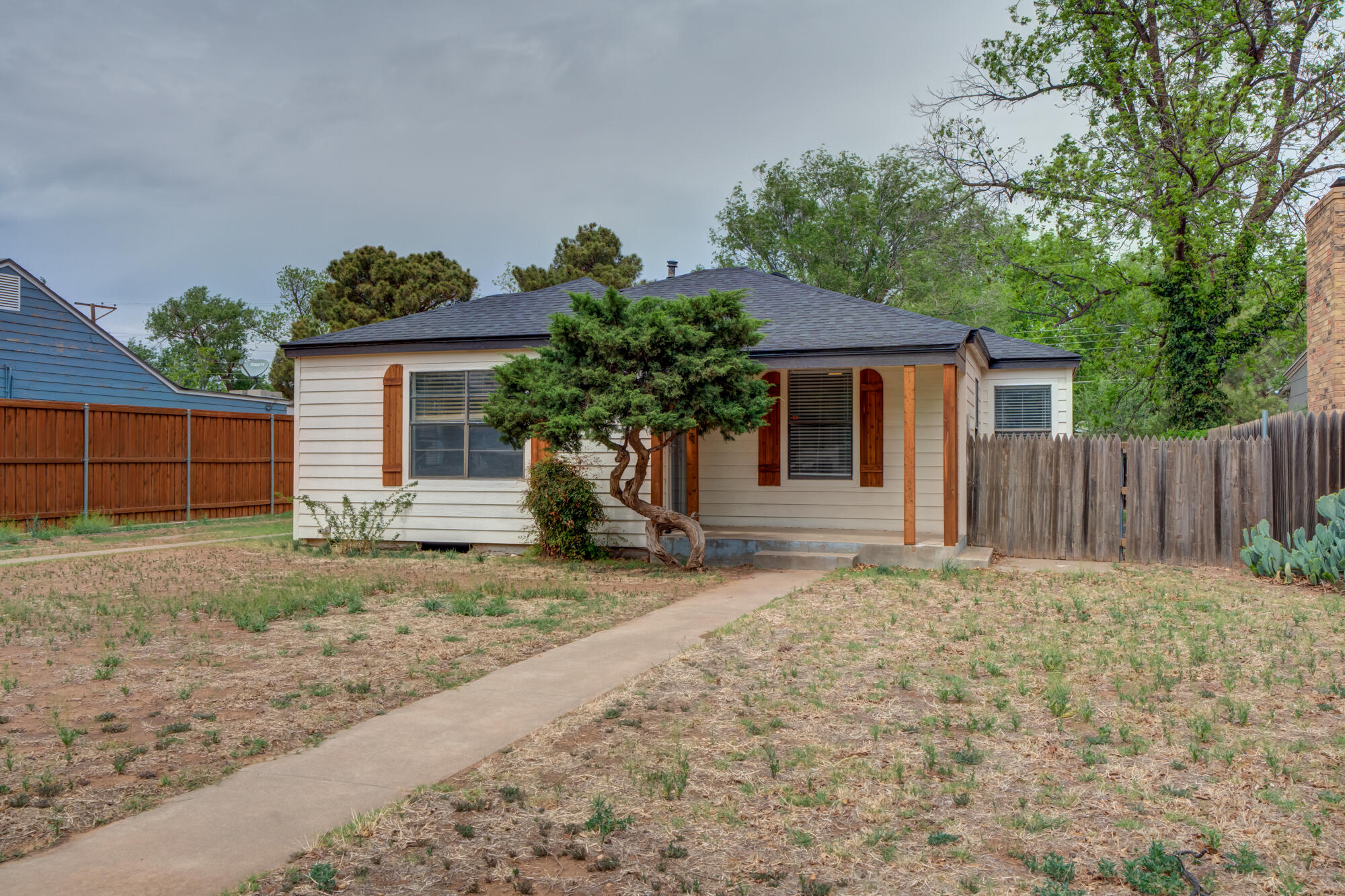 2308 30th Street Lubbock, TX 79411 - Photo 3 of 21 a house with trees in front of it