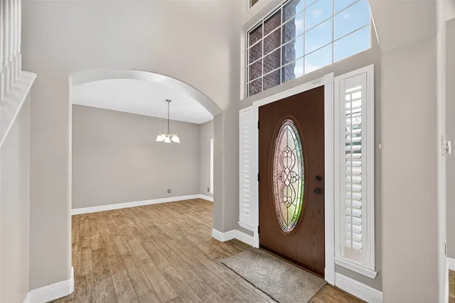 a view of an entryway with a hallway