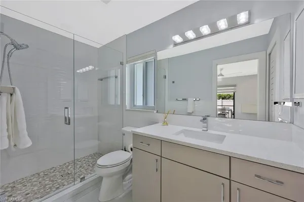 a bedroom with a bed and a lamp