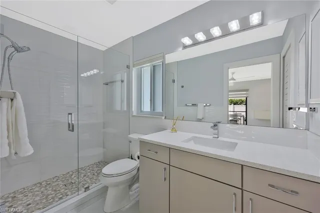 a bedroom with a bed and a lamp