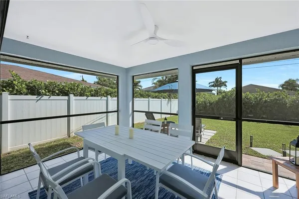 a bedroom with 2 bed and a window